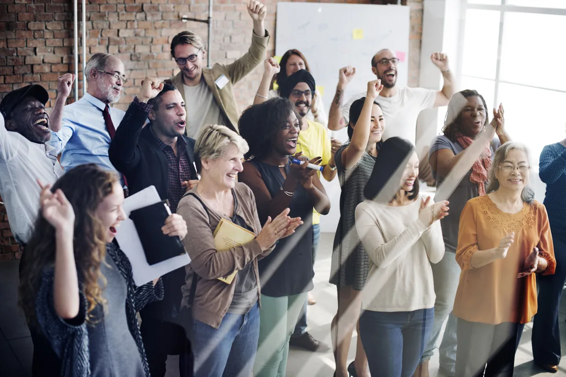 People applauding in a shared office